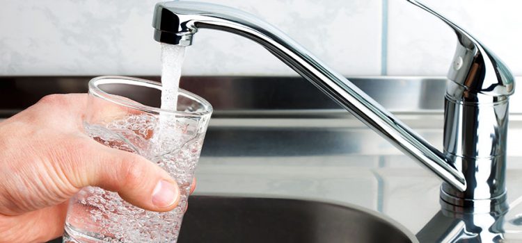 a sink faucet treated by a water softener in Austin