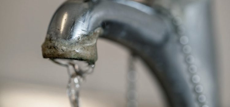 Faucet with calcium buildup due to hard water