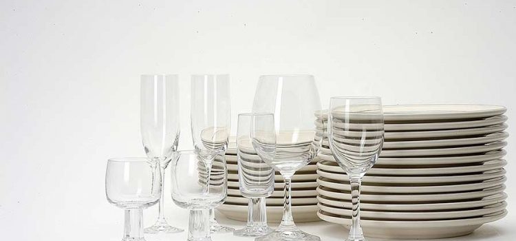 Shiny clean glasses and plates arranged in a still life