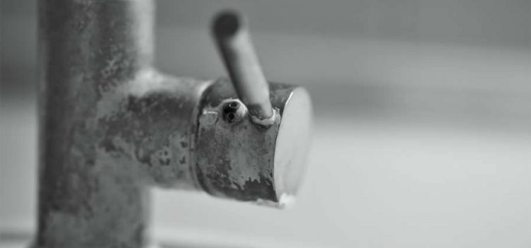 Mineral build-up on sink faucet that could be resolved by a water conditioner company that sells water softeners in Austin, Tx