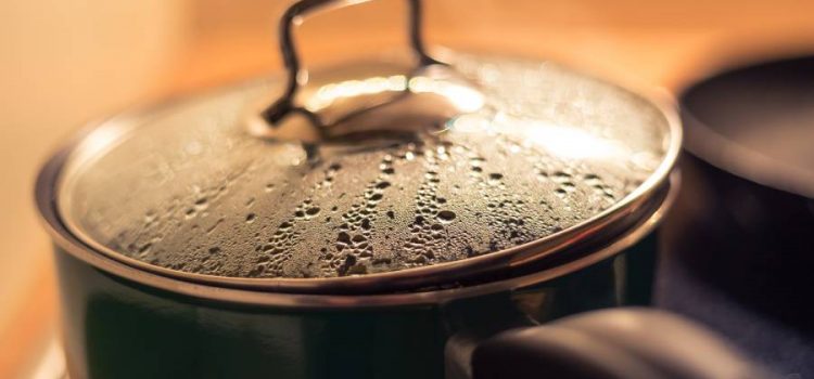 Boiling water in a pot on a stove instead of using water treatment solutions such as water filtration or a water softener in Austin, Tx