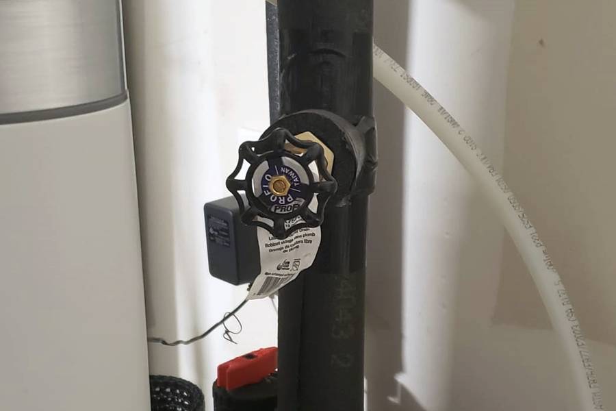 Hose spigot attached to a water softener