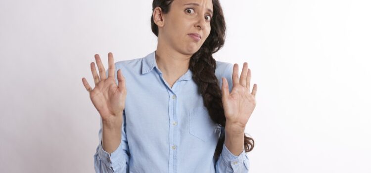 A woman experiencing an unpleasant sulfur smell emanating from the tap due to issues with quality from Austin water systems.