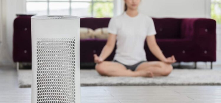 Woman meditating in a purified room thanks to Air purification in Austin.