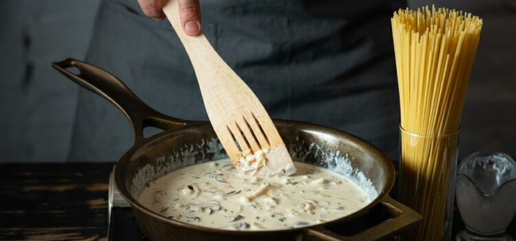 Image of a chef in Kyle preparing a savory sauce using clean and purified water filtered through a water filter