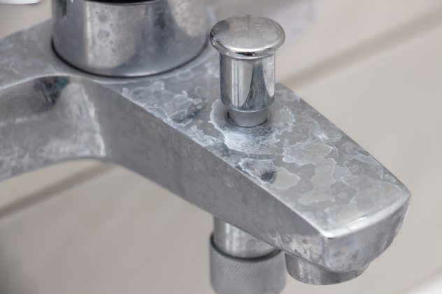 A faucet with calcium buildup