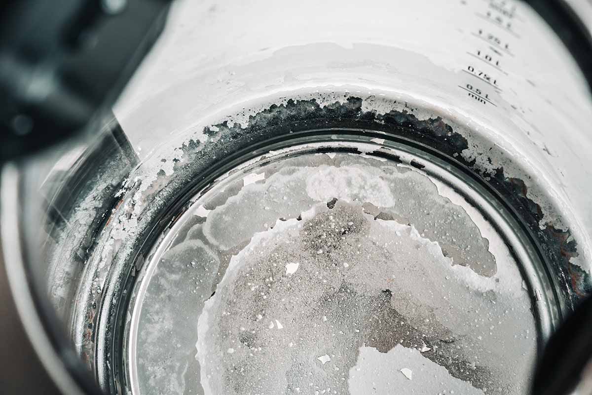 Unsightly limescale build-up at the bottom of a drip coffee pot